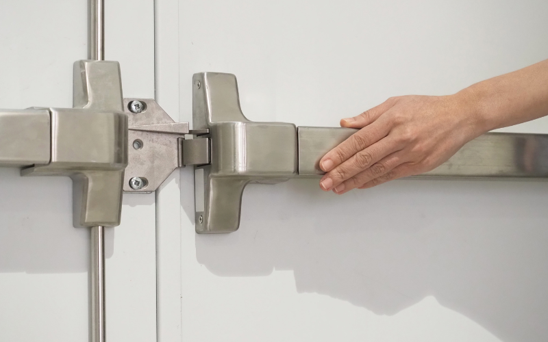 Commercial steel fire door with closer and latching hardware for NFPA 80 inspection